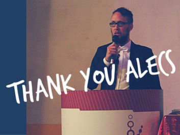 Alecs Recher speaking at a TGEU meeting, accompanied by the overlaid text 'Thank you, Alecs.'