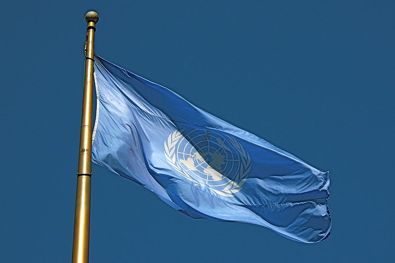A United Nations flag waving.