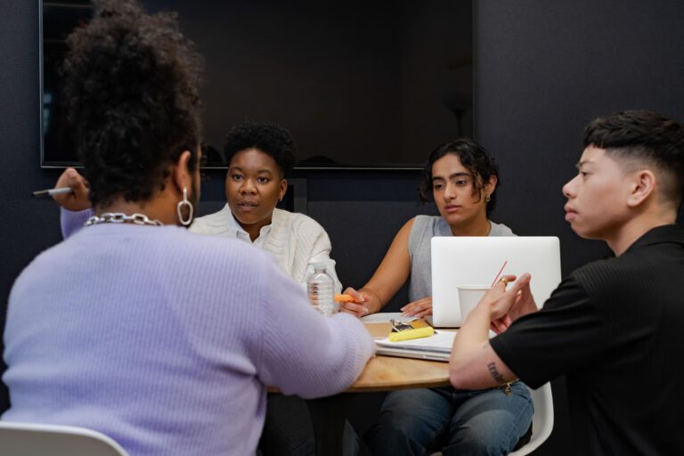 People of varying genders having a meeting