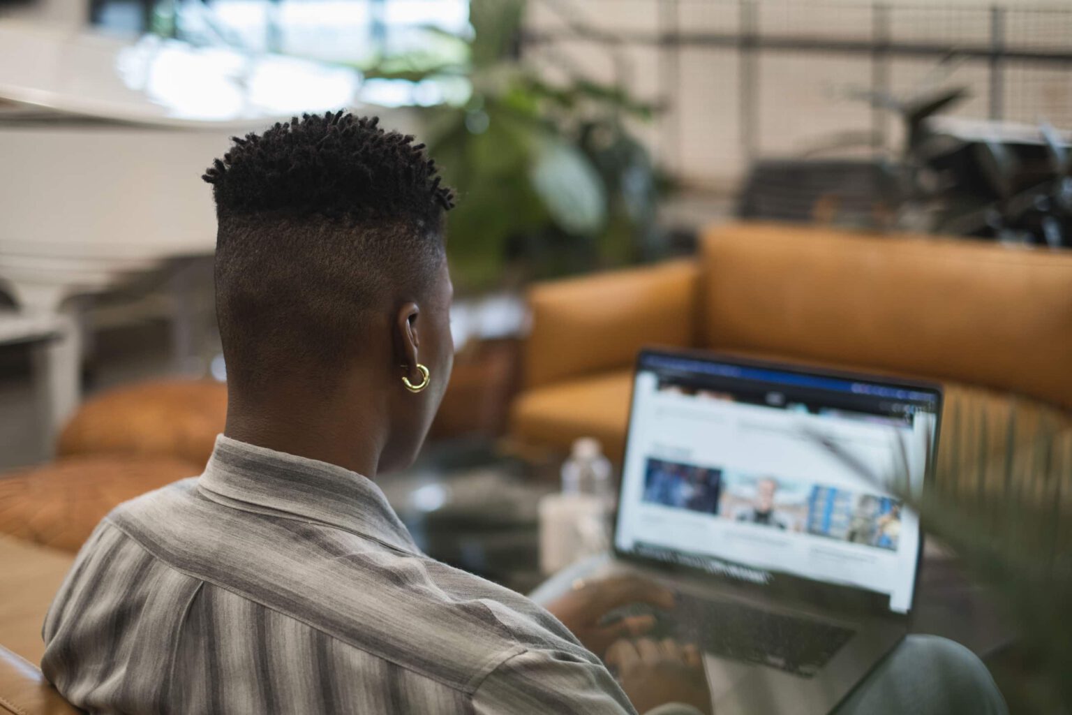 Trans person working on a laptop