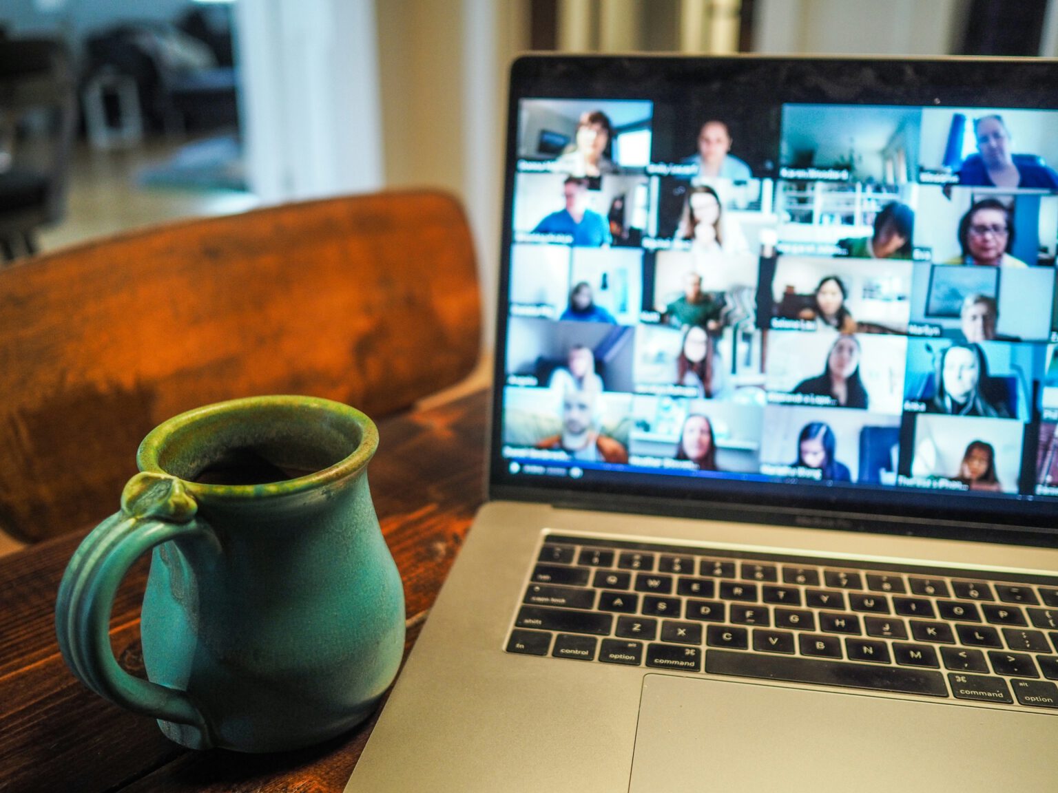 Online meeting shown on laptop screen