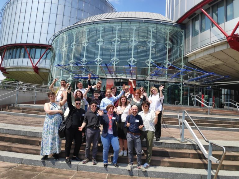 group of trans activists in front of the Council of Europe in Strasbourg, France.